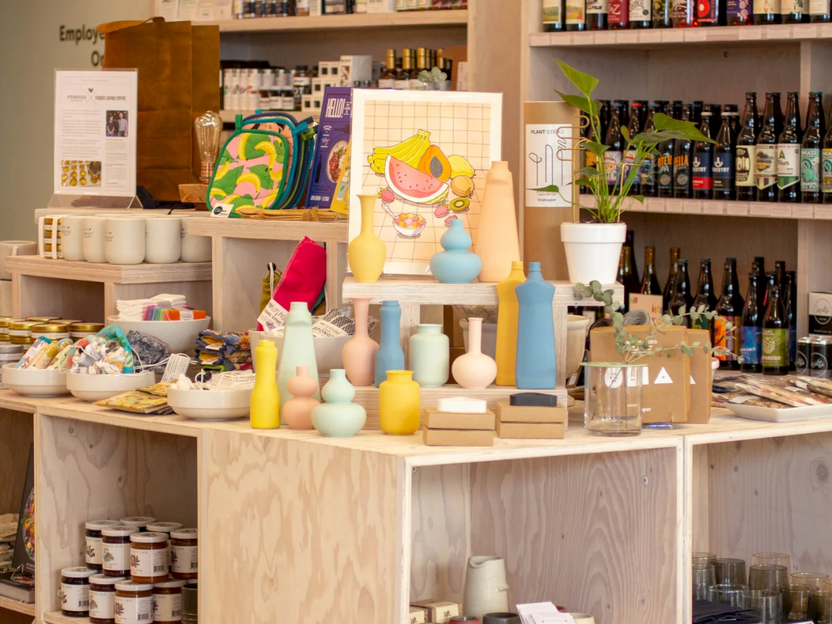 A boutique store with shelves of colorful home goods and bottles.